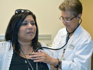 Kathryn Joyce (right), nurse practitioner, examines Irene Fuentez (left) at Westover Medical Home in northwest San Antonio. The Westover Medical Home earned the National Committee for Quality Assurance’s highest level of recognition as a Patient Centered Medical Home and achieved Level 3 certification on its initial NCQA survey after opening its doors 16 months ago.