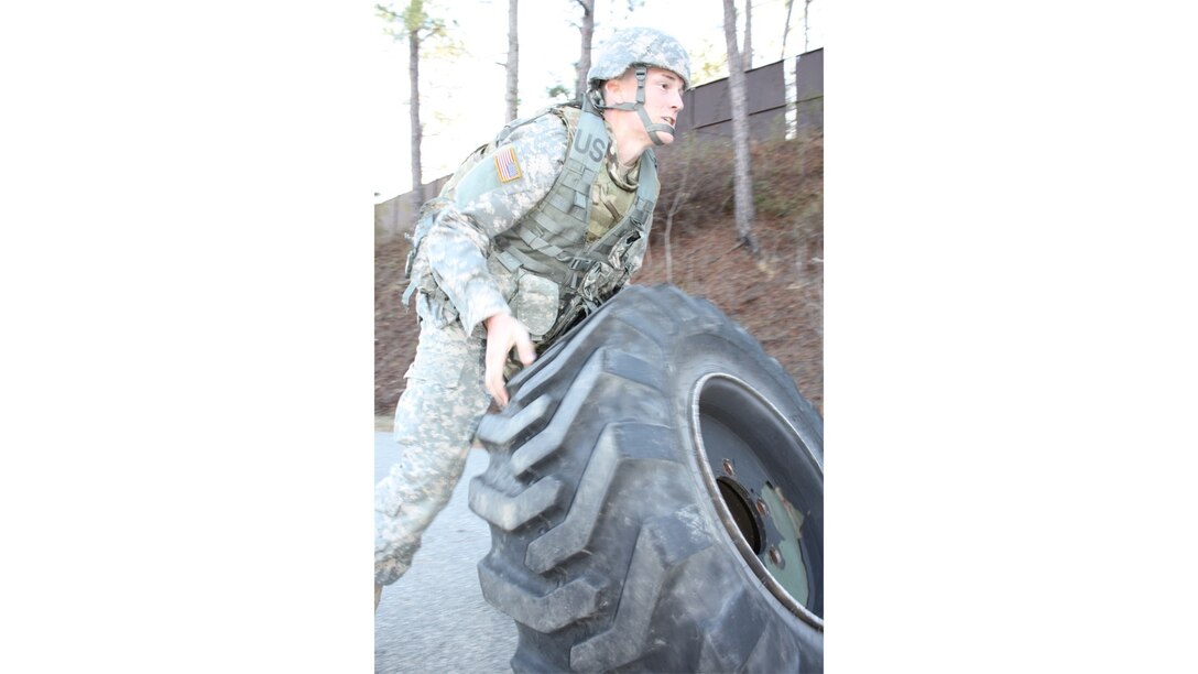 Spc. Christopher Childress with the 1184th Deployment and Distribution Support Battalion, Mobile, Alabama rolls a large tire end over end during one of the last events of this year’s Best Warrior competition hosted by the Deployment Support Command at Fort Benning, Georgia. The winners of this competition will go on to compete in the 377th Theater Support Command's Best Warrior Competition beginning April 9 at Joint Base McGuire Dix Lakehurst, New Jersey. 