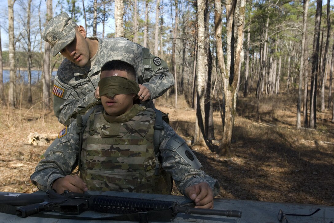 Private 1st Class David Ortiz from Brooklyn, New York of the 652nd Transportation Detachment out of Fort Totten, New York is blind folded by Staff Sgt. Felix Encarnacion of the 1179th Transportation Brigade also in Brooklyn, before he disassembles and reassembles a M16 rifle. This event followed an eight-mile road march and is just one of the events Soldiers competed in during the Deployment Support Command’s 2017 Best Warrior Competition. The annual competition pits Soldier against Soldier to earn the privilege of representing the Deployment Support Command at the next level of competition and eventually in the All Army Best Warrior Competition. 