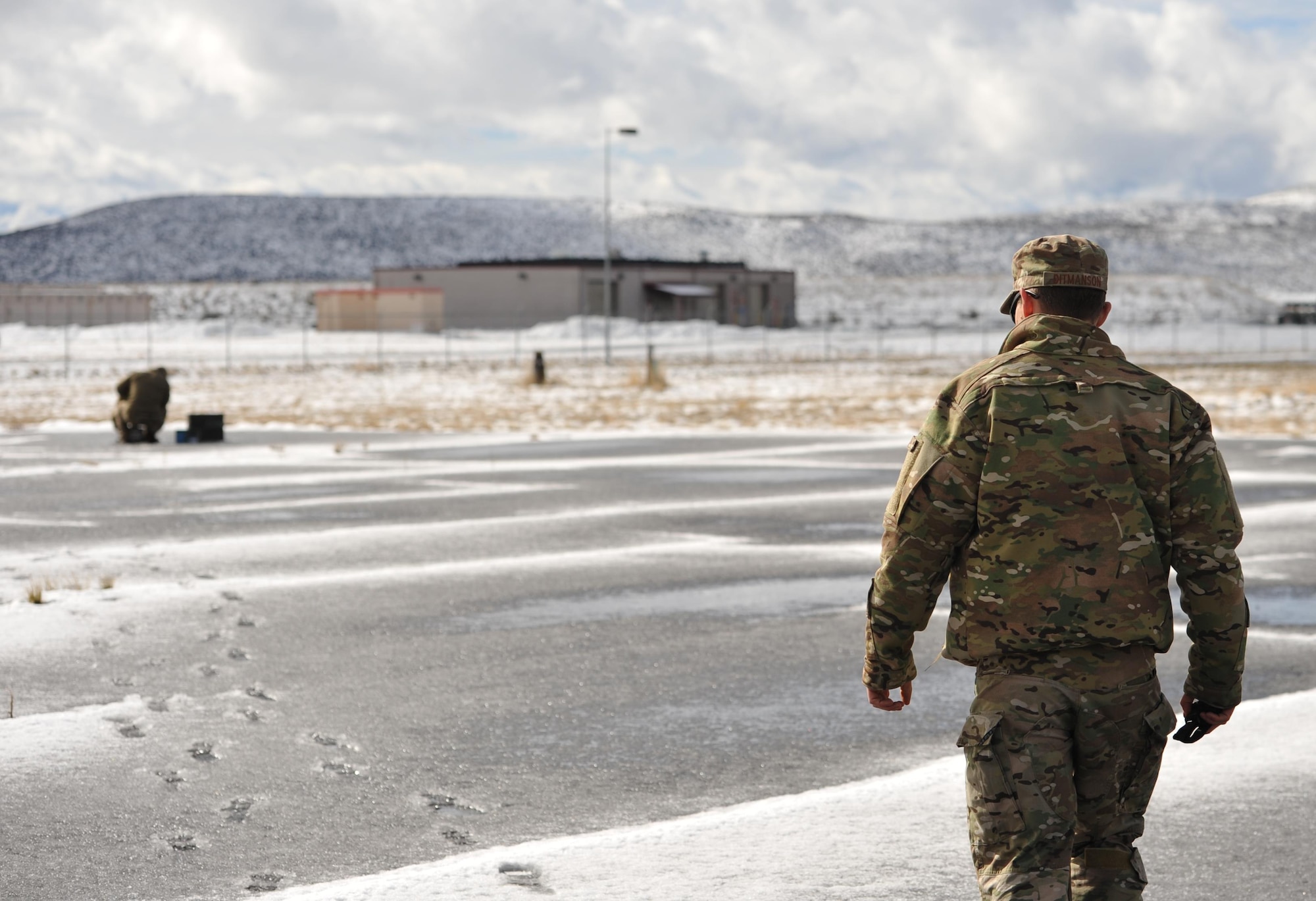 Staff Sgt. Travis Ditmanson, 9th Civil Engineer Squadron explosive ordnance disposal technician, watches his team prepare a flare for disposal Feb. 7, 2017 at Kingsley Field, Oregon. The EOD team used C-4 and blasting caps to detonate the flare. (U.S. Air Force photo/Airman Tristan D. Viglianco)