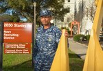 Petty Officer 1st Class Eric Petdan, command career counselor assigned to Navy Recruiting District San Antonio, stands next to one of two gold anchors situated in front of the NRD headquarters.  Originally black, the anchors were painted gold in 2014 after the command was recognized as one of the winners of the Navy’s Manpower, Personnel, Training and Education (MPT&E) Retention Excellence Award for Fiscal Year 2013.  The NRD was again awarded the honors for Fiscal Years 2015 and 2016. 