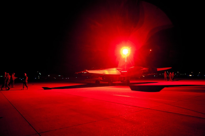 An F/A-18C Hornet with Marine Fighter Attack Squadron (VMFA) 323 “Death Rattlers” waits to conduct night operations at Naval Air Station Fallon, Nev., Feb. 15. The Death Rattlers, one of two Marine Hornet squadrons to deploy aboard Navy aircraft carriers, trained at NAS Fallon to strengthen tactical air integration, fulfill predeployment requirements and build rapport with the Navy squadrons they will deploy with in summer 2017. (U.S. Marine Corps photo by Sgt. Lillian Stephens/Released)