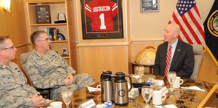U.S. Air Force Gen. John E. Hyten (second from left), commander of U.S. Strategic Command (USSTRATCOM), discusses USSTRATCOM’s missions, roles and responsibilities, and potential partnering opportunities with Nebraska Gov. Pete Ricketts at USSTRATCOM headquarters, Offutt Air Force Base, Neb., Feb. 17, 2017.