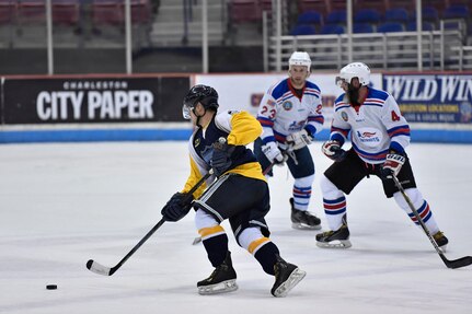 Members of the Charleston Patriots and the Charleston Enforcers skate during the 3rd Annual Matuskovic Charity Hockey Game at the North Charleston Coliseum & Performing Arts Center, Feb. 18, 2017. The game is played in memory of Joe Matuskovic, Charleston County Sherriff’s deputy, and other service members and first responders killed in the line of duty.  Members of the Charleston Patriots are from Joint Base Charleston while members of the Charleston Enforcers are from the Charleston County Sheriff’s office and fire department.The Charleston Enforcers won the game with a final score of 10-2. 