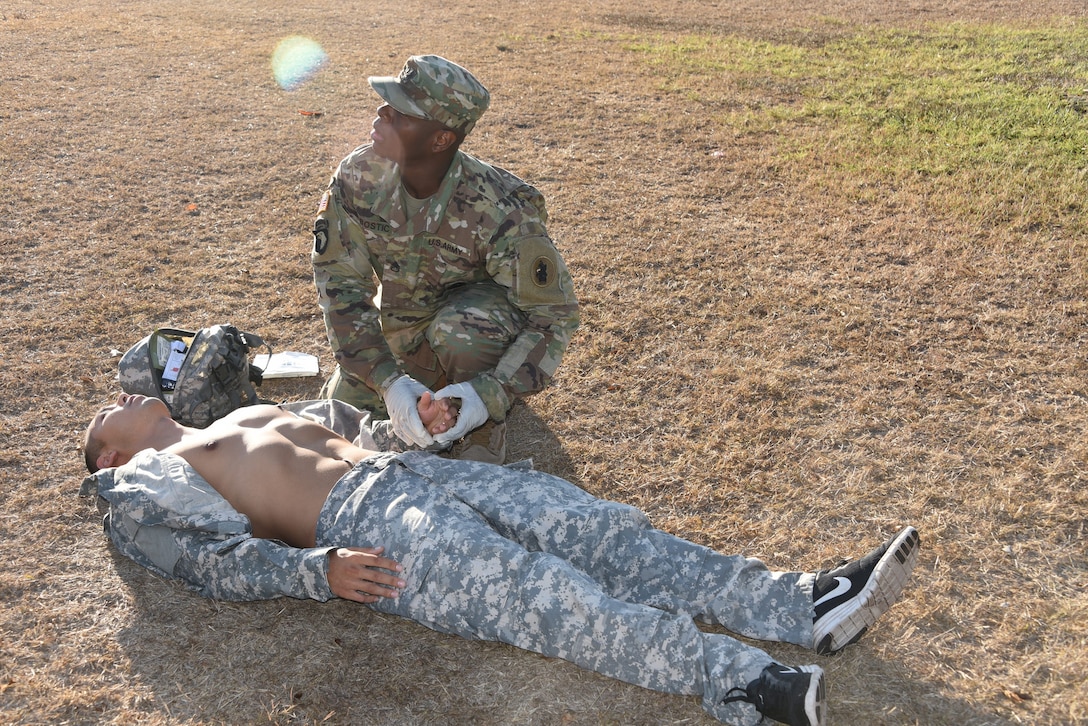 After a recent post-wide competition among six servicemembers, Army Staff Sgt. Otis Bostic, Supply NCO, represents the Army as the named NCO of the 2nd Quarter for JTF-Bravo. Bostic is pictured performing medical readiness tasks as part of the board competition.
