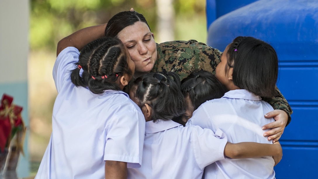 Navy Petty Officer 1st Class Samantha Clark bids farewell to Thai students during a ceremony to mark the completion of a school expansion project during Cobra Gold 2017 in Rayong Province, Thailand, Feb. 21, 2017. The exercise focused on advancing regional security and ensuring effective responses to regional crises by bringing together a multinational force to address shared goals and security commitments in the Indo-Asia-Pacific region. Clark is a hospital corpsman assigned to the 1st Marine Expeditionary Force Headquarters Group. Navy photo by Petty Officer 2nd Class Markus Castaneda