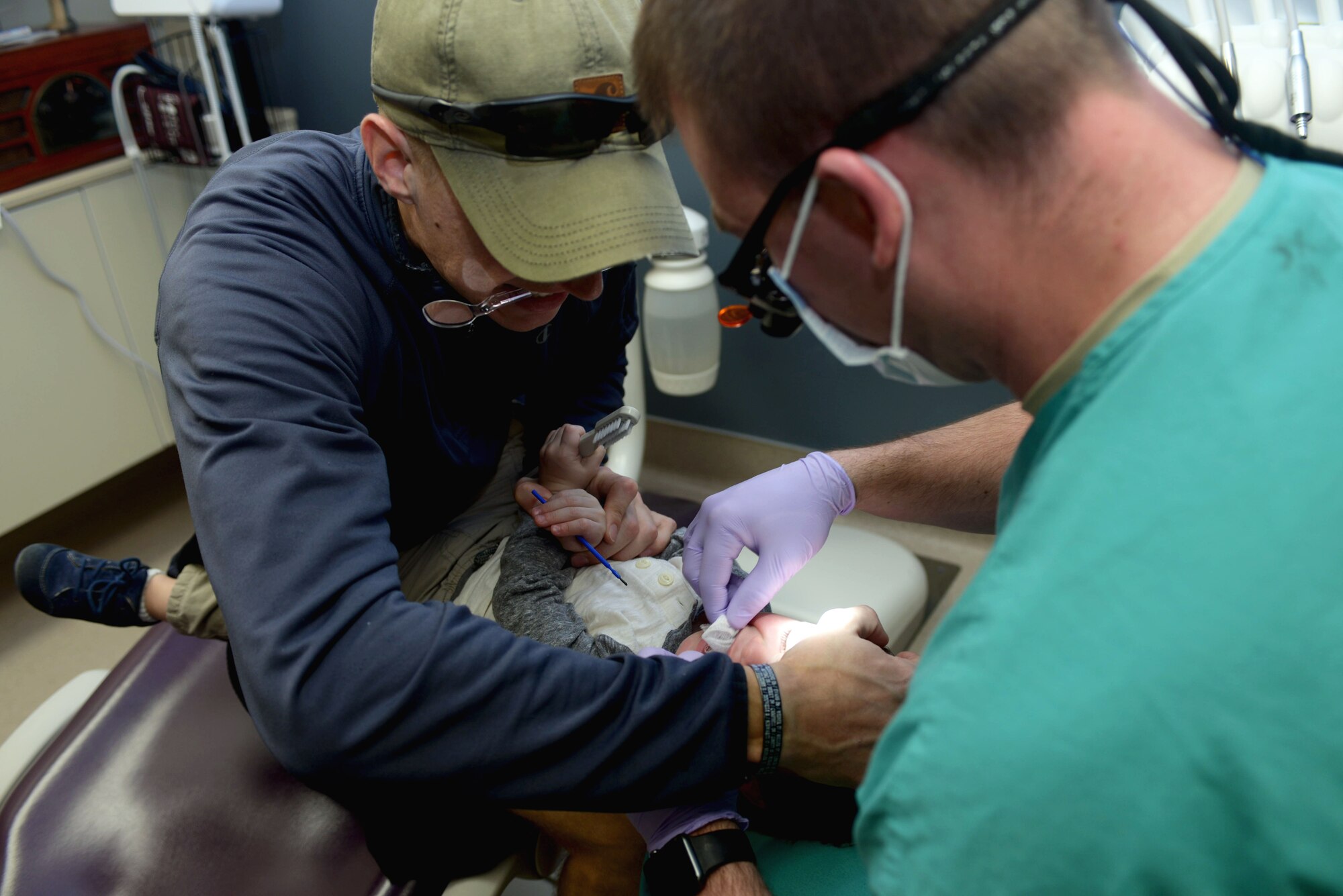 Levi Nicholas, son of Nathalie and Staff Sgt. Andrew Nicholas, an explosive ordnance disposal journeyman assigned to the 38th Civil Engineer Squadron, receives dental care in the 28th Medical Group dental office at Ellsworth Air Force Base, S.D., Feb. 15, 2017. Give Kids a Smile has two purposes — helping children get dental care they need and to raise awareness about the importance of taking care of one’s dental health. (U.S. Air Force photo by Airman 1st Class Donald C. Knechtel)