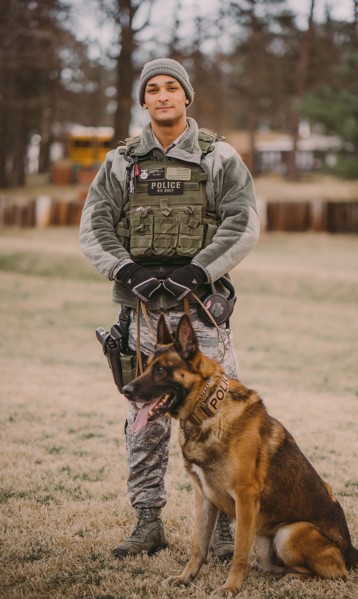 Staff Sgt. Christopher Pettis, 11th Security Forces Squadron military working dog handler, awaits a K-9 demonstration during a base tour for Baltimore Polytechnic Institute High School Air Force Junior Reserve Officer Training Corps at Joint Base Andrews, Md., Feb. 16, 2017. The tour was an opportunity for the base to promote a closer relationship with the local community. (U.S. Air Force photo by Senior Airman Delano Scott)