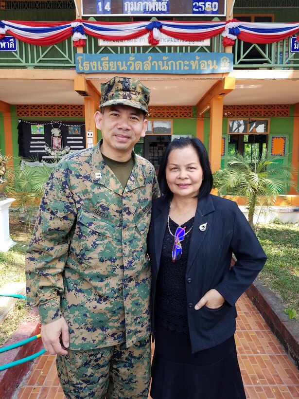 U.S. Navy Reserve Chaplain Aroon Seeda reunites with his primary school teacher Mrs. Pairor Sa-ngiemrat after more than 30 years during a visit to Wat Sam Nakkaton school on Feb. 14 near Sattahip, Thailand by U.S. service members for exercise Cobra Gold 2017. The Thai-U.S. co-sponsored exercise represents the longstanding friendship between the Thai and American people and their commitment to work together in support of peace and security in the region.