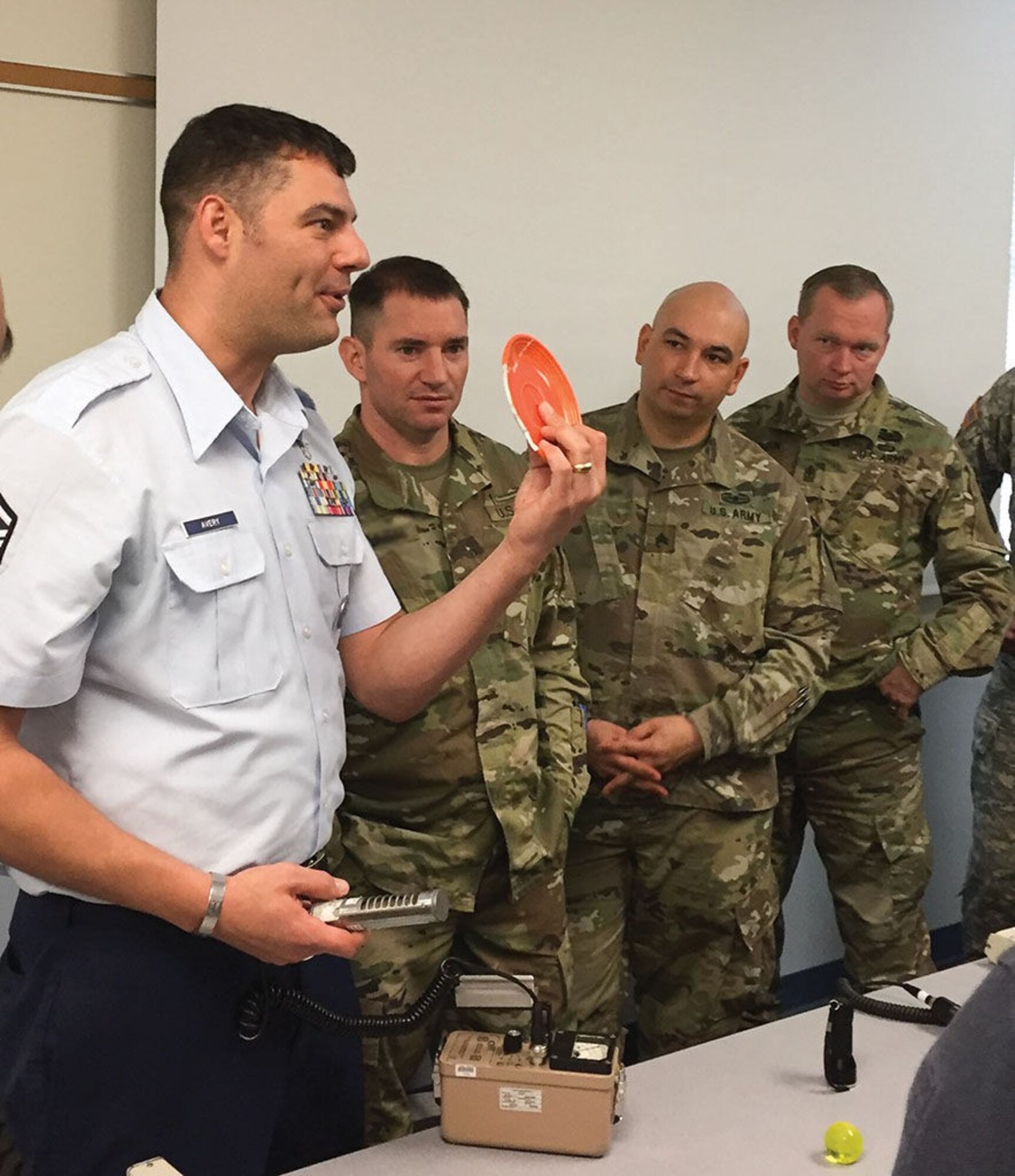 Master Sgt. Lucas Avery, Defense Nuclear Weapons School instructor at Kirtland, demonstrates techniques in radiological detection to members of the Texas Army National Guard and area first responders Feb. 2 in Round Rock, Texas. Avery is a member of the mobile training team that traveled to Texas to teach the DNWS Introduction to Radiological and Nuclear Incident Response course.