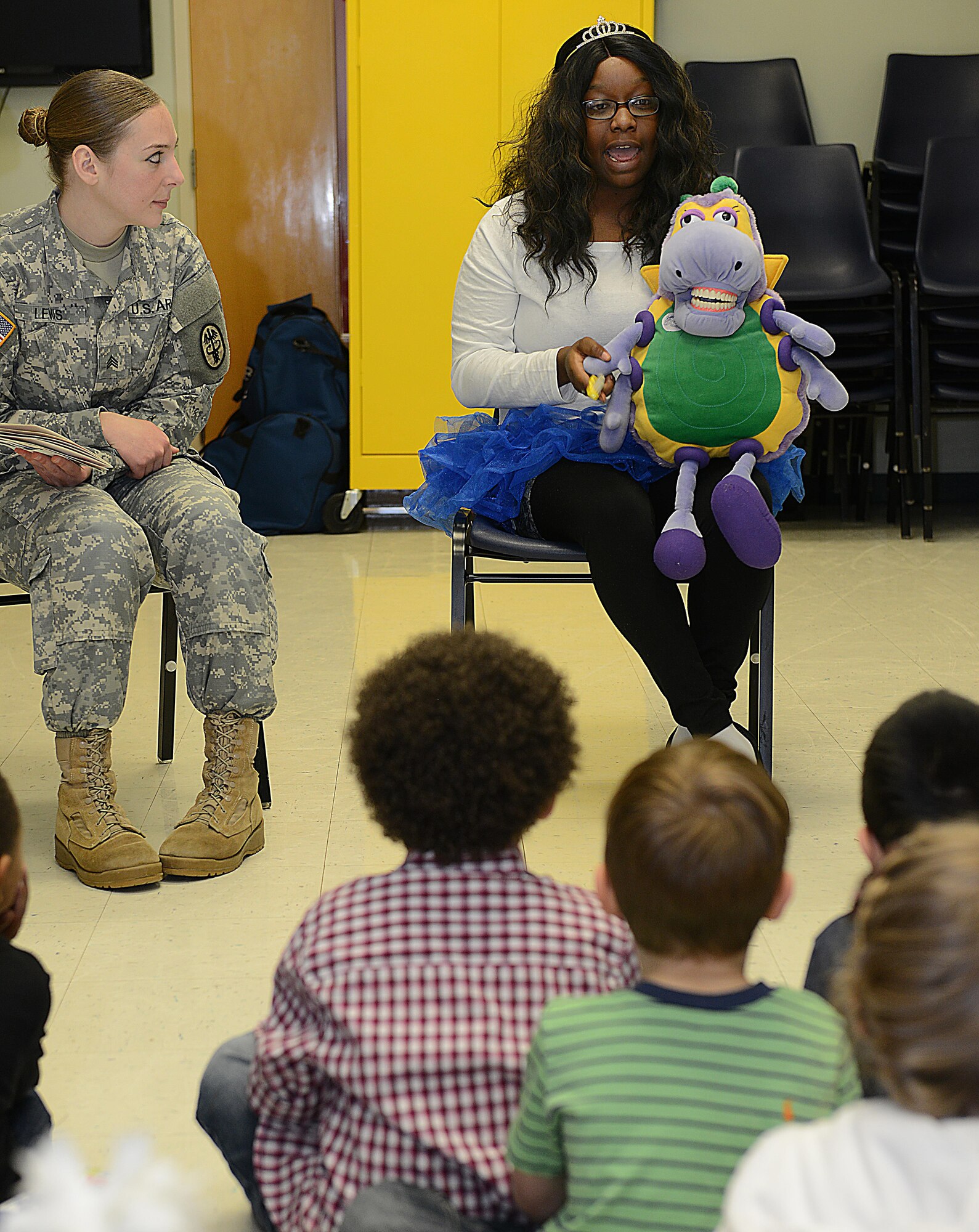 U.S. Army. Pvt. Jade Ross, U.S. Army Dental Health Activity dental assistant, demonstrates the proper way children should brush their teeth at the Madison Child Development Center at Joint Base Langley-Eustis, Va., Feb. 17, 2017. Playing the role of the tooth fairy, Ross asked children questions about how often and how long they should brush their teeth. (U.S. Air Force photo by Staff Sgt. Teresa J. Cleveland)