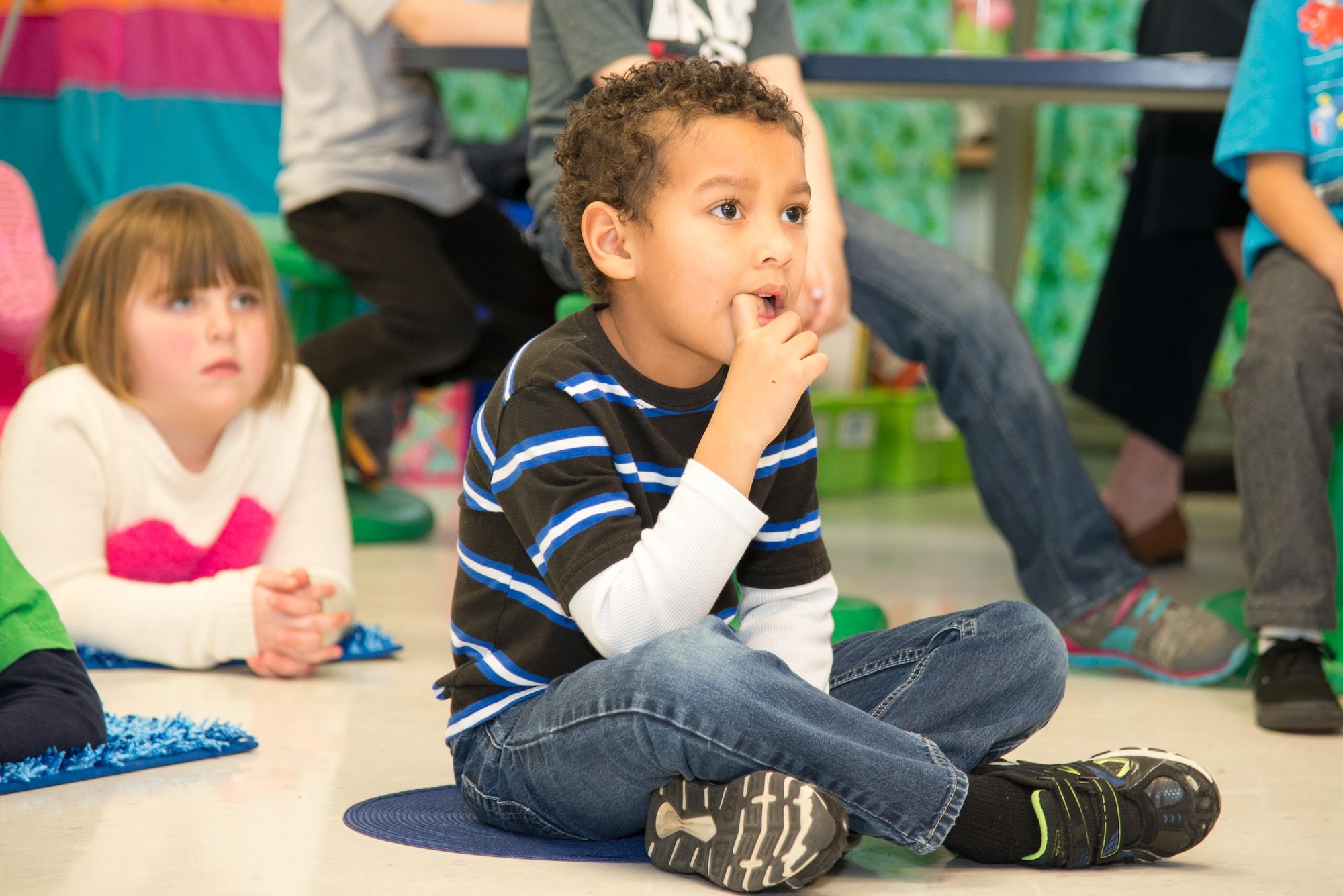 Kindergarten students watch a short play about oral hygiene Feb. 15, 2017, at Welch Elementary School on Dover Air Force Base, Del. The children also played games to help them select heathier foods and were each given a free dental kit that included a toothbrush, toothpaste, an hour glass timer, dental floss and dental themed pencils. (U.S. Air Force photo by Mauricio Campino)