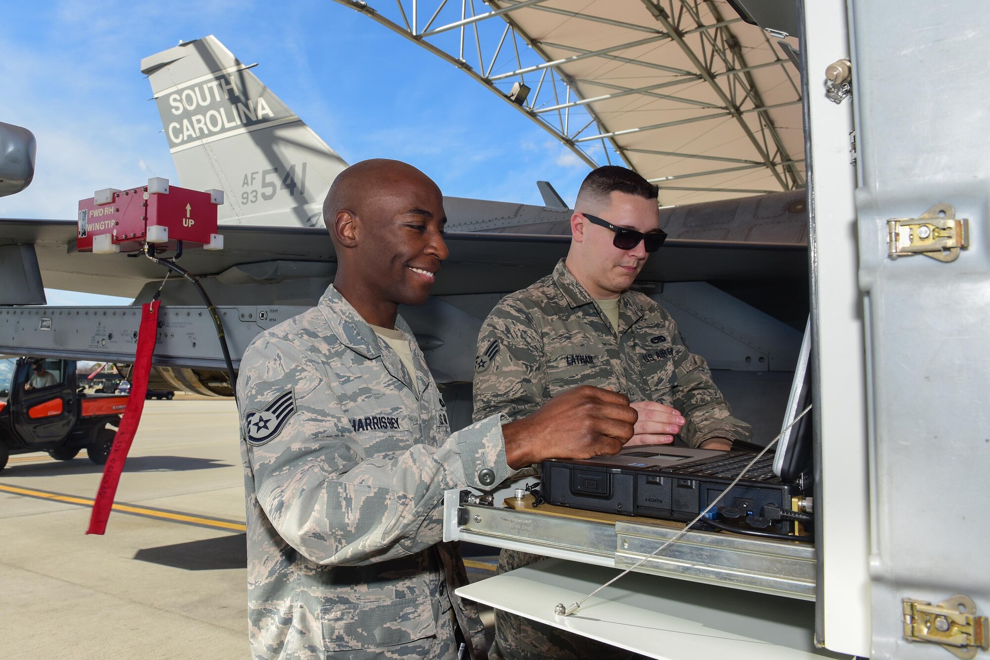 U.S. Air Force Staff Sgt. Timothy Harris-Bey, left, and Senior Airman Brock Latham, right, both inspectors from the 16th Electronic Warfare Squadron at Eglin Air Force Base, Fla., run tests on  one of the South Carolina Air National Guard’s F-16 Fighting Falcons at McEntire Joint National Guard Base, Jan. 18, 2017. The electronic warfare systems used on S.C. Air National Guard F-16 Fighting Falcons underwent the annual inspection; ensuring testing and maintenance requirements are properly conducted. (U.S. Air National Guard photo by Airman 1st Class Megan Floyd)