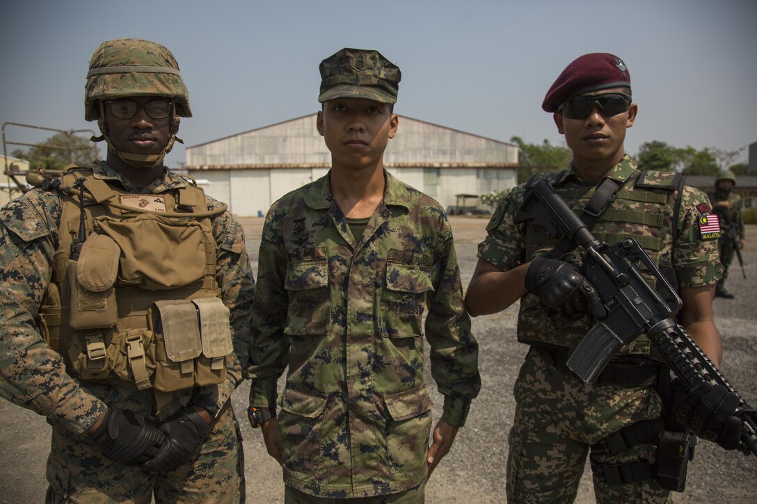 Service members from the U.S., Thailand, and Malaysia guard the processing center for a noncombatant evacuation operation, as part of Cobra Gold 17 at Naval Airbase Utapao, Thailand, Feb. 19, 2017. The drill was conducted to exercise joint, multinational cooperation during disaster relief. Cobra Gold is the largest Theater Security Cooperation exercise in the Indo-Asia-Pacific region and is an integral part of the U.S. commitment to strengthen engagement in the region. U.S., Thai, Malaysian and Japanese forces participated in the disaster relief drill.