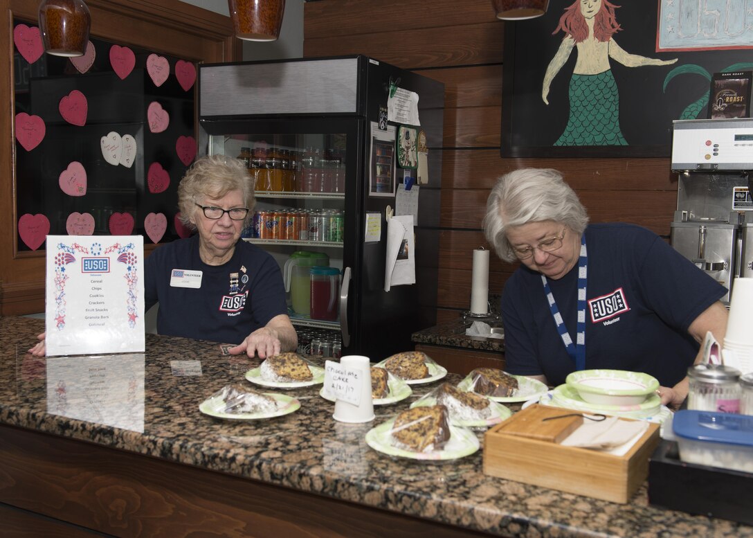 Josie Donithan and Kathy Spanarelli, USO Delaware volunteers, maintain all amenities that are available for service members and their families at the USO Delaware center Feb. 21, 2017, at Dover Air Force Base, Del. The mission of the USO is to strengthen America’s military service members by keeping them connected to family, home and country, throughout their service to the nation. (U.S. Air Force photo by Senior Airman Zachary Cacicia)