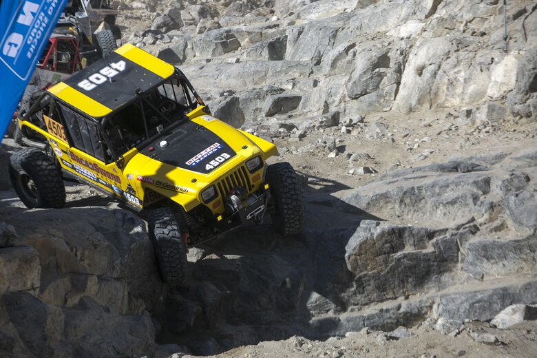 Gunnery Sgt. Adam Arsenault, a mission planning instructor at Expeditionary Warfare Training Group Pacific, currently stationed at Naval Air Station Coronado, and Marine Corps CWO 3 Spencer Morris, a counter intelligence officer, currently stationed at the Pentagon, drive car 4503 through “Back door” during the King of the Hammers race in Johnson Valley, Calif., Feb. 9, 2017. (Official Marine Corps Photo by Cpl. Julio McGraw/Released)
