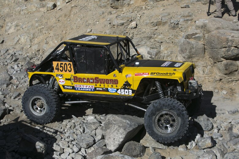 Gunnery Sgt. Adam Arsenault, a mission planning instructor at Expeditionary Warfare Training Group Pacific, currently stationed at Naval Air Station Coronado, and CWO 3 Spencer Morris, a counter intelligence officer, currently stationed at the Pentagon, operate car 4503 during the King of the Hammers Race in Johnson Valley, Calif., Feb. 9, 2017. The race is held at the shared use area in Johnson Valley and extends into the northern border of Marine Corps Air Ground Combat Center Twentynine Palms, Calif. ( Official Marine Corps Photo by Cpl. Julio McGraw/Released)
