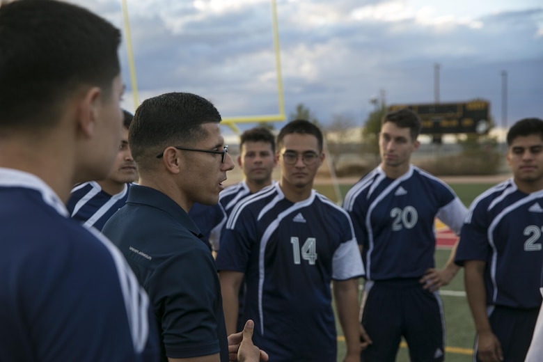 Chief Warrant Officer 2 Anton Cuevas, head coach, 29 Palms Futbol Club, addresses his team before a penalty kick shootout during a pre-season game versus Pendleton FC at Felix Field aboard Marine Corps Air Ground Combat Center, Twentynine Palms, Calif., Feb. 11, 2017. 29 Palms FC is preparing for a tournament at Fort Irwin National Training Center in April. (U.S. Marine Corps photo by Lance Cpl. Dave Flores)