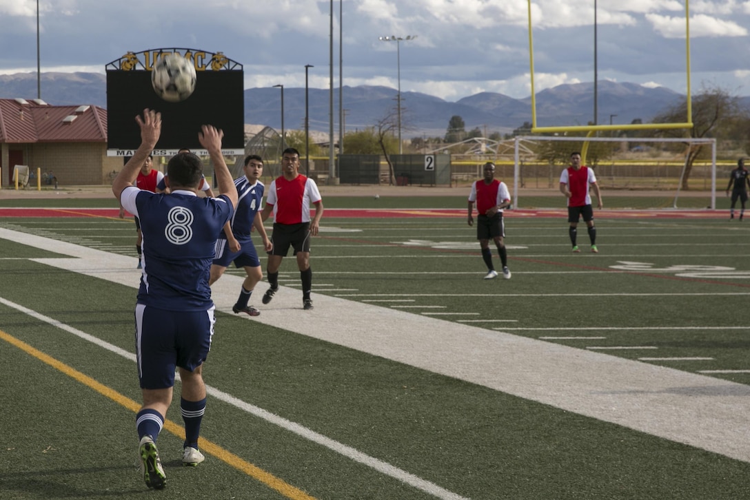 A player with 29 Palms Futbol Club throws the ball back into play during a pre-season game versus Pendleton FC at Felix Field aboard Marine Corps Air Ground Combat Center, Twentynine Palms, Calif., Feb. 11, 2017. 29 Palms FC is preparing for a tournament at Fort Irwin National Training Center in April. (U.S. Marine Corps photo by Lance Cpl. Dave Flores)