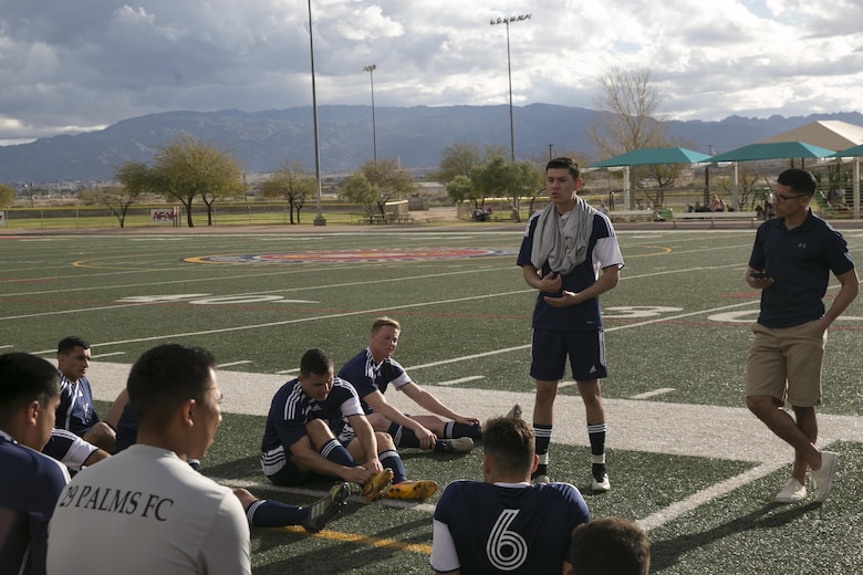 Cpl. Marco A. Perez, coach and player, 29 Palms Futbol Club speaks to his team at half-time during a pre-season game versus Pendleton FC at Felix Field aboard Marine Corps Air Ground Combat Center, Twentynine Palms, Calif., Feb. 11, 2017. 29 Palms FC is preparing for a tournament at Fort Irwin National Training Center in April. (U.S. Marine Corps photo by Lance Cpl. Dave Flores)