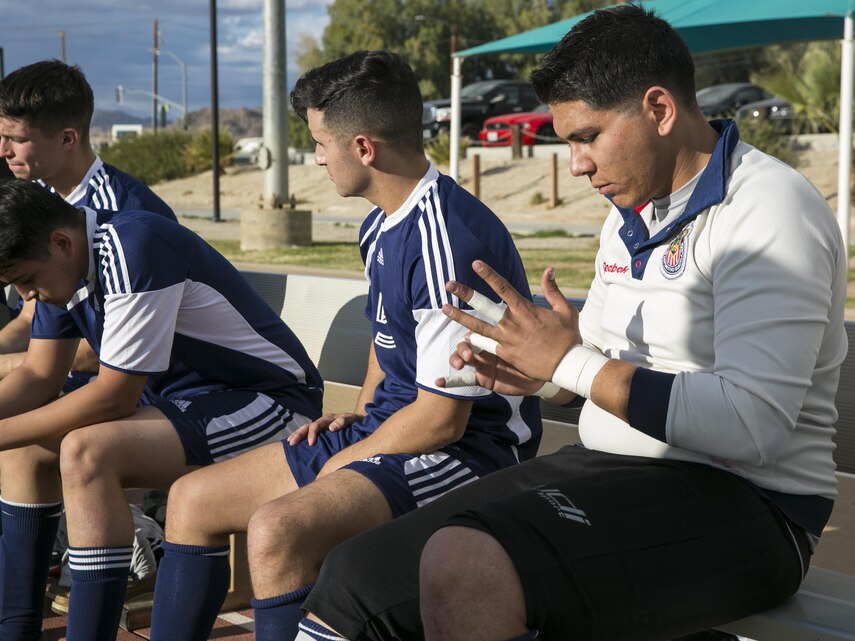 A goalie with 29 Palms Futbol Club preps at half time during a pre-season game versus Pendleton FC at Felix Field aboard Marine Corps Air Ground Combat Center, Twentynine Palms, Calif., Feb. 11, 2017. 29 Palms FC is preparing for a tournament at Fort Irwin National Training Center in April. (U.S. Marine Corps photo by Lance Cpl. Dave Flores)