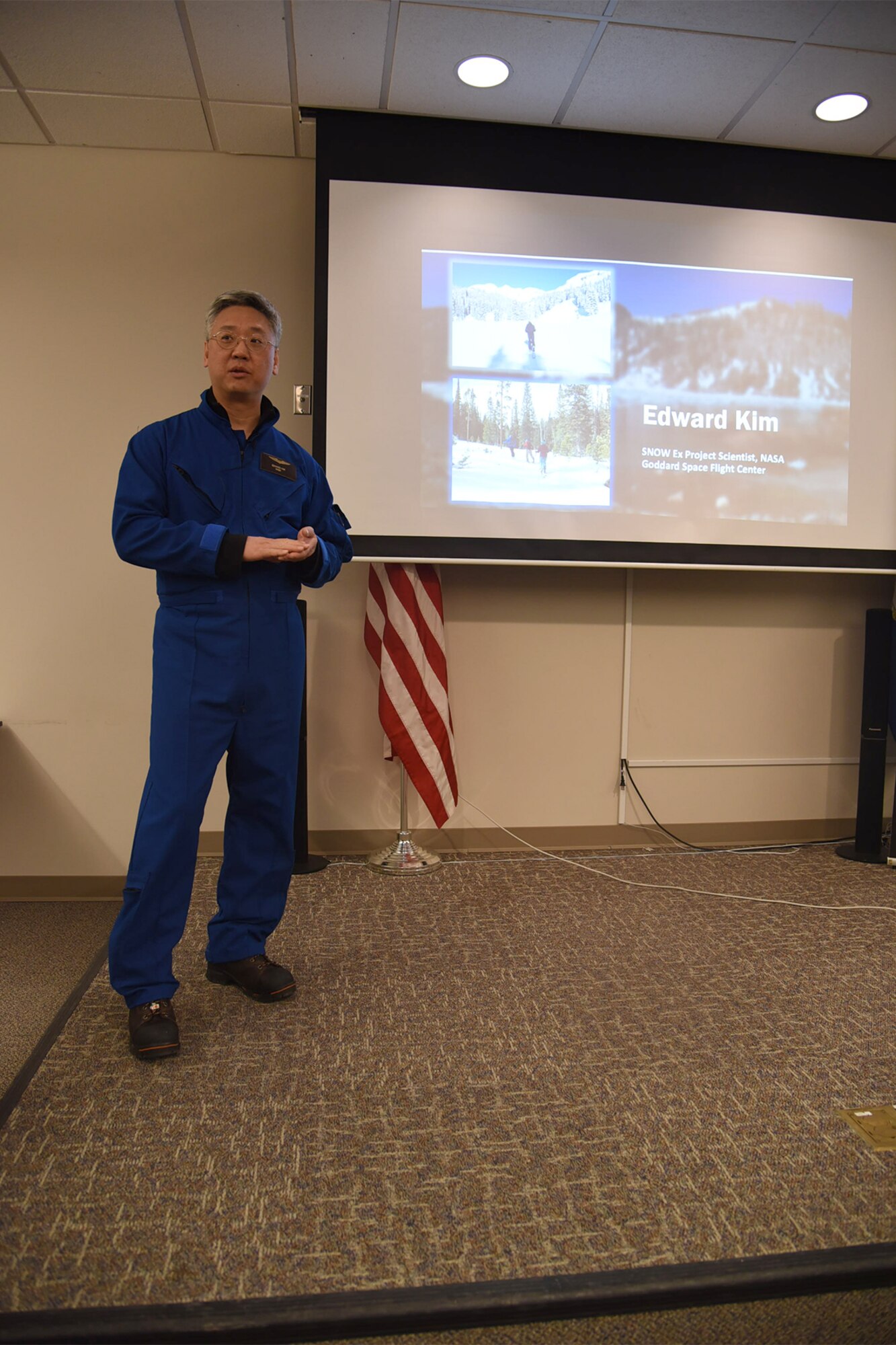 PETERSON AIR FORCE BASE, Colo.—Lead project scientist Edward Kim stands before media at Peterson Air Force Base, Colorado, Feb. 17, to discuss the SnowEx mission.  SnowEx, a project to test various instruments for taking measurements of snowpack, is a collaborative effort being led by NASA that will take five years to complete. (U.S. Air Force photo by Robb Lingley)