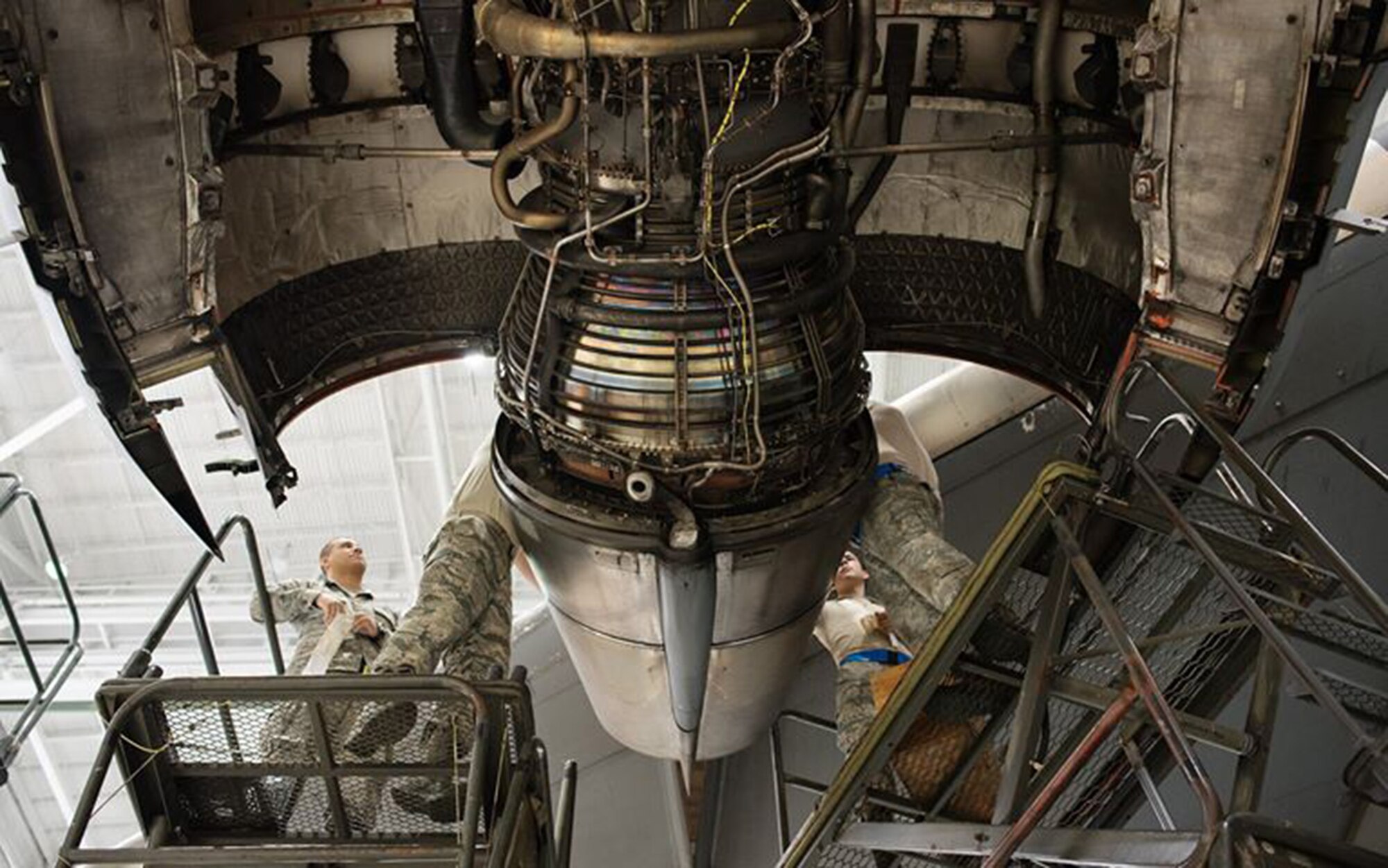 A crew of Citizen Airmen from the 945th Aircraft Maintenance Squadron at Travis Air Force Base, Calif., work together to replace C-17 Globemaster III engine panels, Feb. 10, 2017. The reservists were on duty to participate in Wrench Week 2017, which offers Citizen Airmen opportunities to reinforce and build their primary job skills.