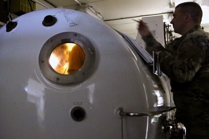 Master diver 1st Sgt. Tyler Dodd with the 511th Engineer Dive Detachment out of Fort Eustis, Va., oversees training of Standard Navy Double Lock Recompression Chamber System, Kuwait Naval Base, Kuwait, Feb. 13, 2017. The training is to give 511th soldiers hands on training in equipment operation, Soldier advancement and to help a Soldier with an injury sustained during a previous training exercise.