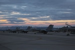 Several F/A-18C Hornets with Marine Fighter Attack Squadron (VMFA) 323 “Death Rattlers” rest on the flight line prior to night operations at Naval Air Station Fallon, Nev., Feb. 15. The Death Rattlers, one of two Marine Hornet squadrons to deploy aboard Navy aircraft carriers, trained at NAS Fallon to strengthen tactical air integration, fulfill predeployment requirements and build rapport with the Navy squadrons they will deploy with in summer 2017. (U.S. Marine Corps photo by Sgt. Lillian Stephens/Released)