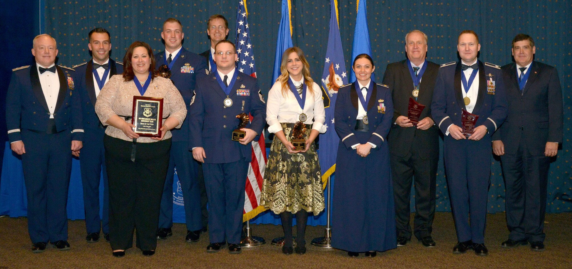 Air Force Nuclear Weapons Center Commander Maj. Gen. Scott W. Jansson, far left, congratulated the center’s annual award winners at a ceremony Feb. 2 at the Mountain View Club. Winners include, back from left, Capt. Robert Drumm, Staff Sgt. Joshua McMillan, John Hedenberg and, front row, starting second from left, Kristina Estrada, Master Sgt. Bradley Hinds, Mykenzie Hamblin, Maj. Marsha Karlan; Dale Hitchcock, Lt. Col. Jason Rossi and Kenneth Pickler. 