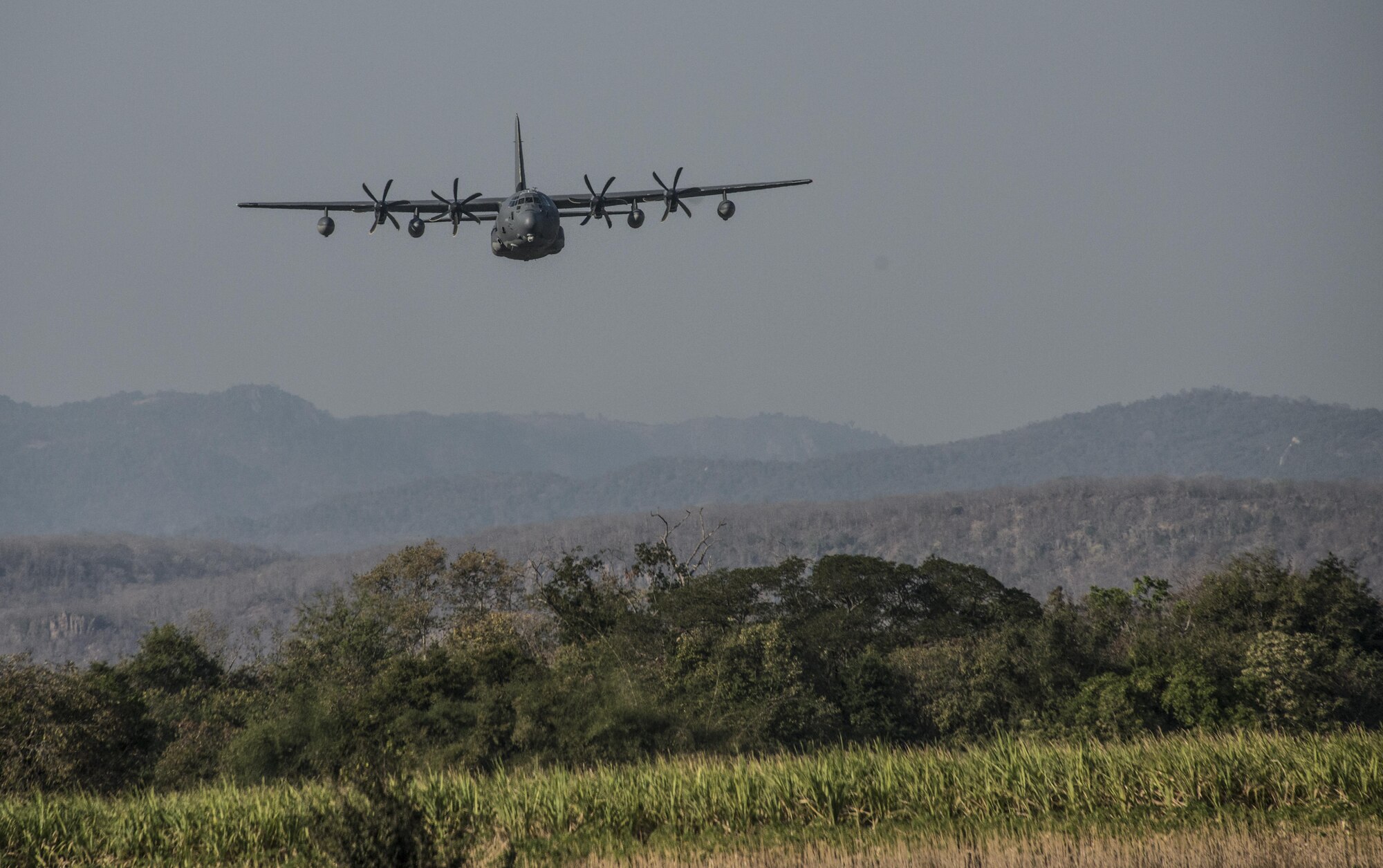 A U.S. Air Force MC-130J Commando II assigned to the 17th Special Operations Squadron conducts low-level operations following military free-fall jumps by combat controllers from the 320th Special Tactics Squadron and Royal Thai Air Force Special Operations Regiment, Feb. 16, 2017 at Chandy Range, Thailand. Throughout Cobra Gold 2017, the 17th SOS provided specialized aviation to members of the 320th STS and RTAF SOR. (U.S. Air Force photo by Capt. Jessica Tait)