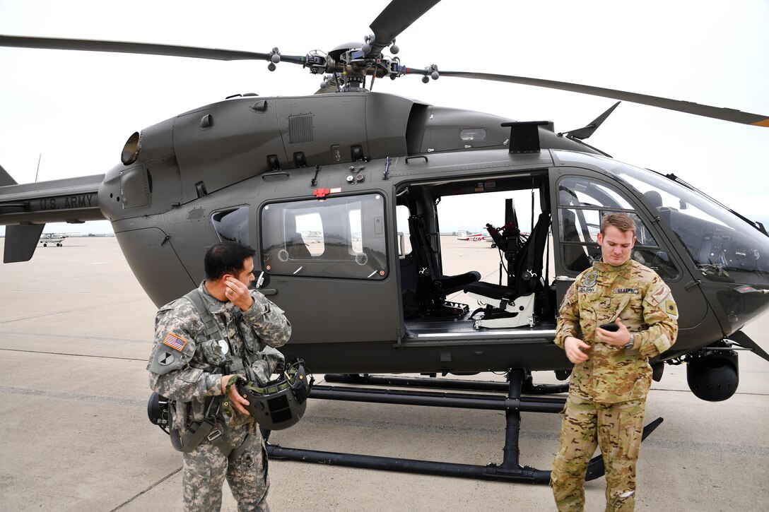 Army National Guard Sgt. 1st Class Marty Ortiz, left and Army National Guard Chief Warrant Officer II Scott Englebrick prepare their gear before departing in their UH-72 Lakota helicopter to take video assessing flood damage in potentially vulnerable areas in Merced County, Merced, Calif., Feb. 19, 2017. Englebrick and Ortiz are assigned to the California Army National Guard’s 1st Battalion, 140th Air Assault Regiment. Air National Guard photo by Senior Airman Daniel Crosier