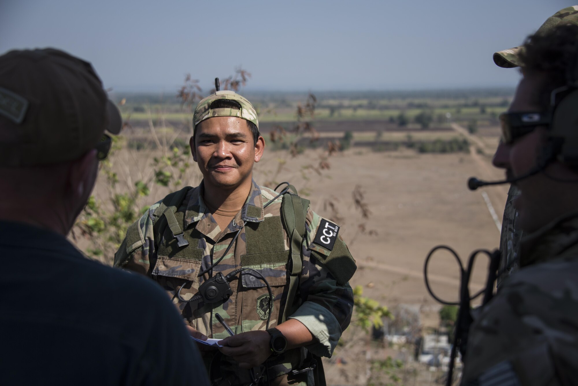 A combat controller from the Royal Thai Air Force Special Operations Regiment receives guidance from joint terminal attack controllers from the 320th Special Tactics Squadron following a training exercise in calling in close air support, Feb. 16, 2017 at Chandy Range, Thailand. Throughout Cobra Gold 2017, the 320th STS and RTAF SOR combat controllers and pararescuemen trained side-by-side to strengthen relationships and increase interoperability. (U.S. Air Force photo by Capt. Jessica Tait)