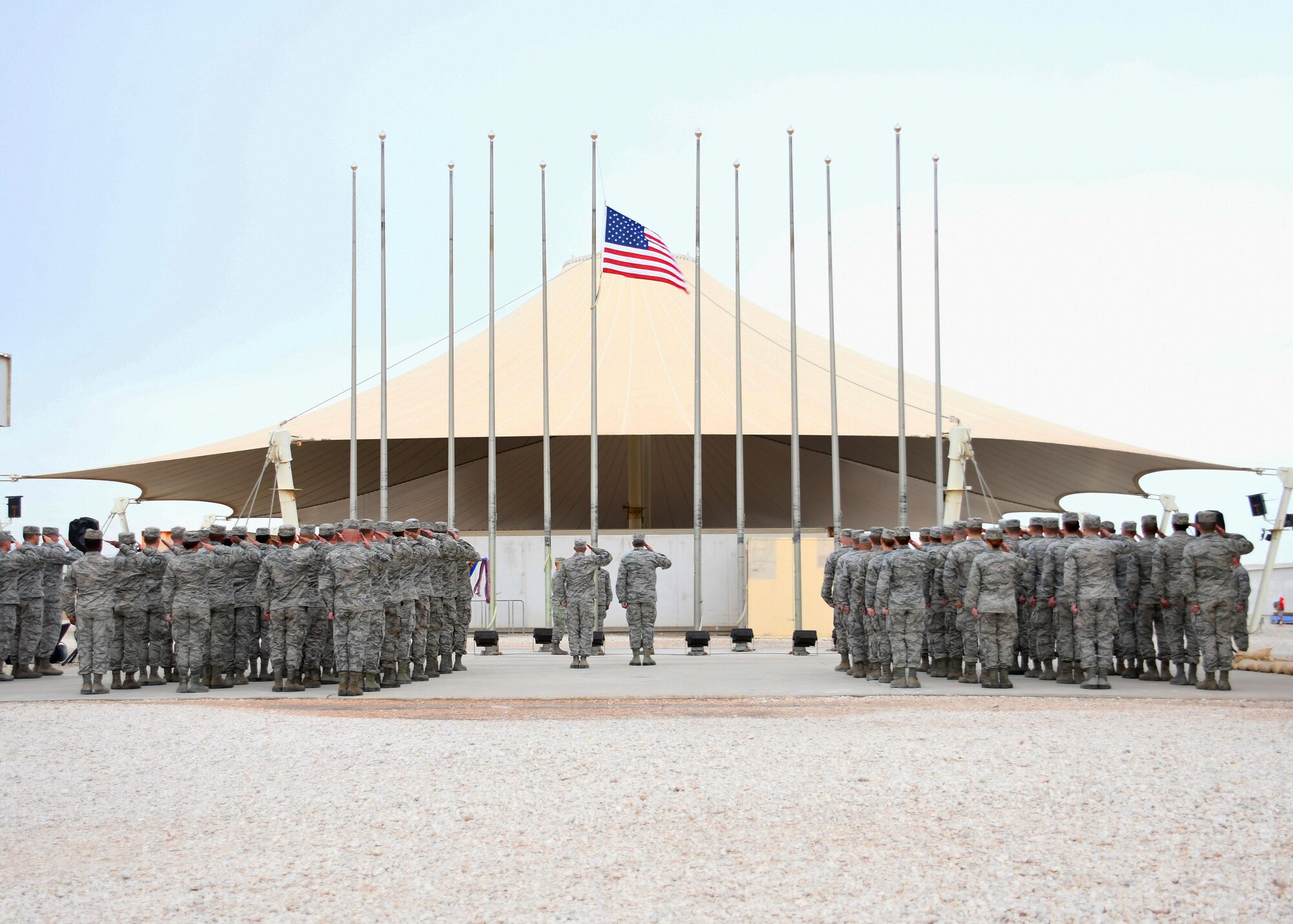 U.S. Airmen stand in formation as an Al Udeid Air Base Honor Guard team lowers the U.S. flag during a Presidents Day retreat ceremony at Al Udeid AB, Qatar, Feb. 20, 2017. Presidents Day honors the lives and contributions of all U.S. Presidents, past and present. (U.S. Air Force photo by Senior Airman Miles Wilson)
