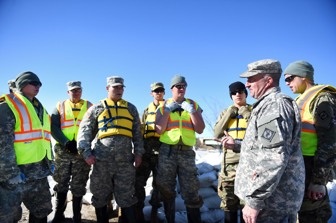Wyoming Army National Guard soldiers receive a safety briefing before helping fill sandbags to reinforce berms along the Bighorn River in Worland, Wyo., Feb. 12, 2017. The Wyoming governor activated about 75 guardsmen to assist the Wyoming Office of Homeland Security to mitigate ice-jam induced flooding in Worland and surrounding areas. Army National Guard photo by Sgt. 1st Class Jimmy McGuire