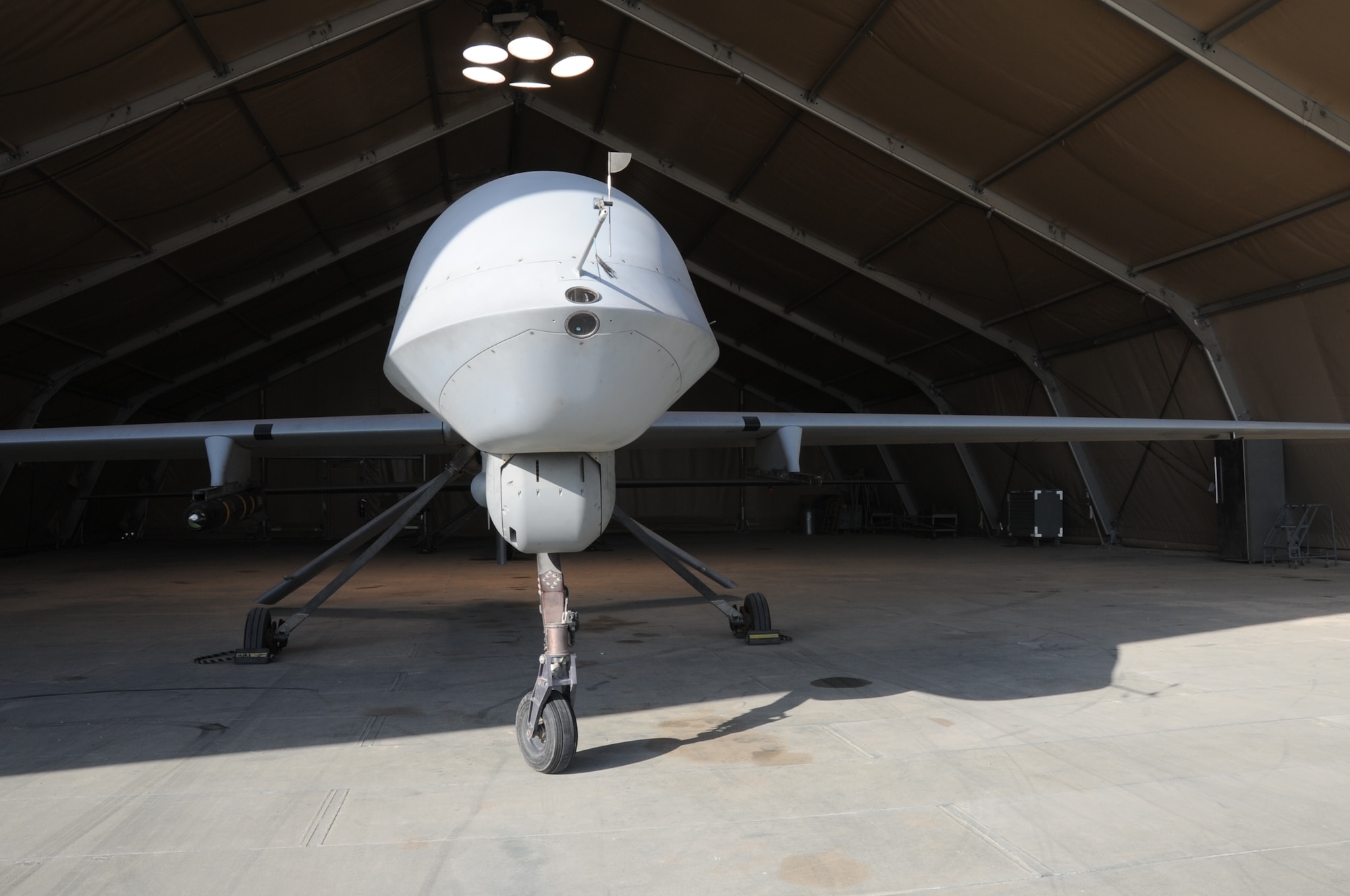 An MQ- 1 predator sits in a hangar Feb. 14, 2017 at an undisclosed location in Southwest Asia.  The 46th Expeditionary Reconnaissance Squadron flies the remotely piloted aircraft to destroy enemy targets and collect intelligence in support of Operation Inherent Resolve.  (U.S. Air Force photo/Tech. Sgt. Kenneth McCann)