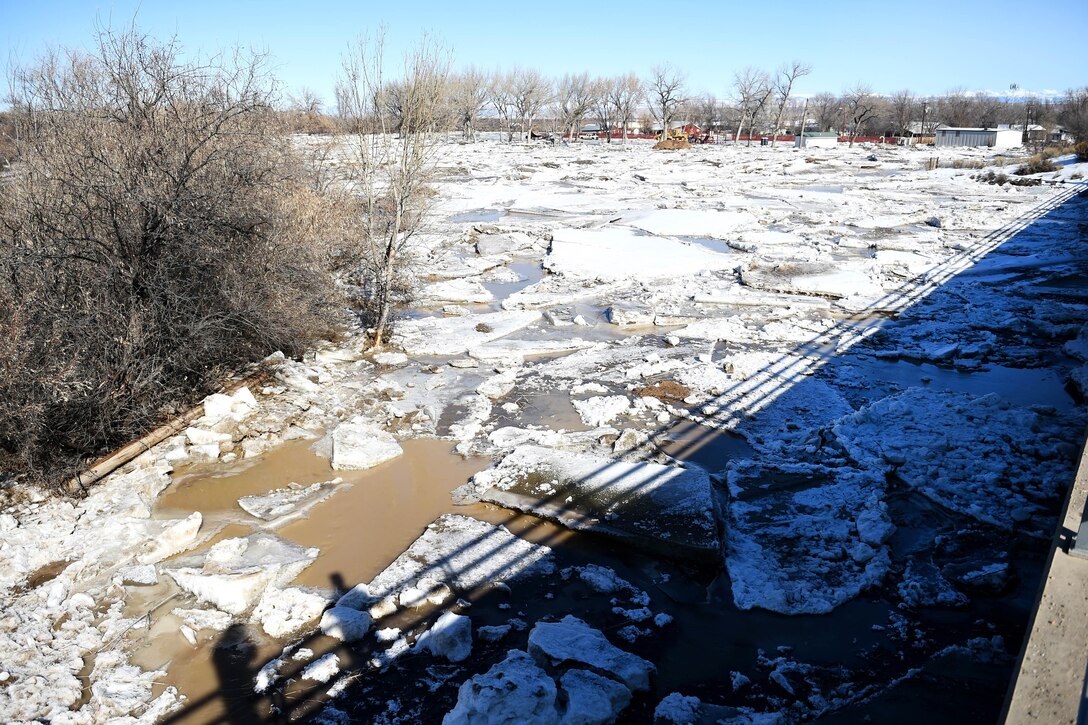 Large sheets of ice cause a jam near the base of a bridge across the Bighorn River in Worland, Wyo., Feb. 12, 2017. Wyoming National Guardsmen assisted with response efforts to mitigate ice-jam induced flooding in the area. Army National Guard photo by Sgt. 1st Class Jimmy McGuire