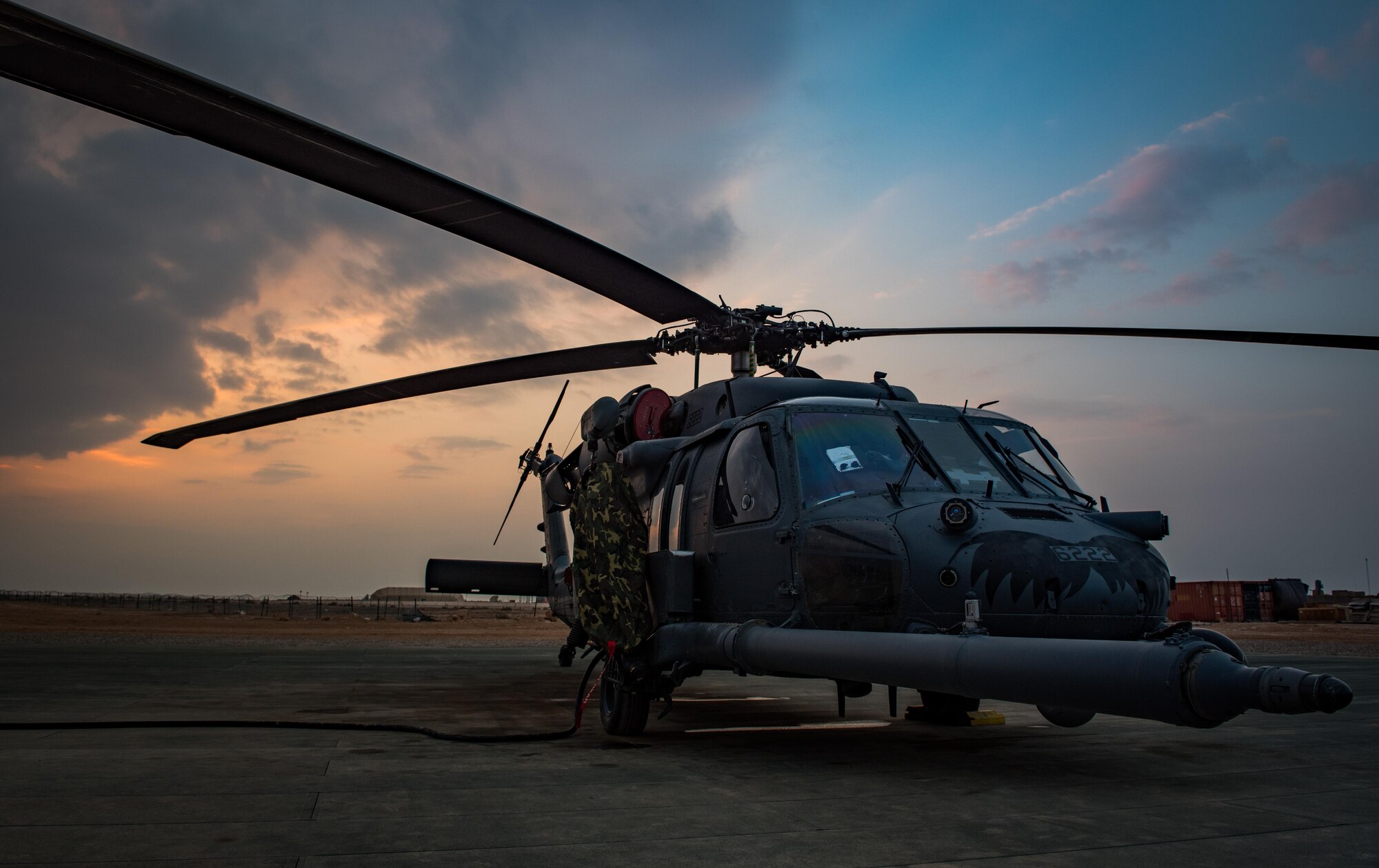 An HH-60 Pave Hawk assigned to the 55th Expeditionary Rescue Squadron – Operating Location Alpha sits on the flightline at Al Asad Air Base, Iraq, Feb. 13, 2017. Airmen assigned to the 55th EQRS-OLA are responsible for providing combat search and rescue support to more than 500,000 square miles of area for the coalition forces of Combined Joint Task Force – Operation Inherent Resolve.  More than 60 Coalition partners have committed themselves to the goal of eliminating the threat posed by ISIS in Iraq and Syria and have contributed in various capacities to the effort. CJTF-OIR is the global Coalition to defeat ISIS in Iraq and Syria. (U.S. Air Force photo/Master Sgt. Benjamin Wilson)(Released)