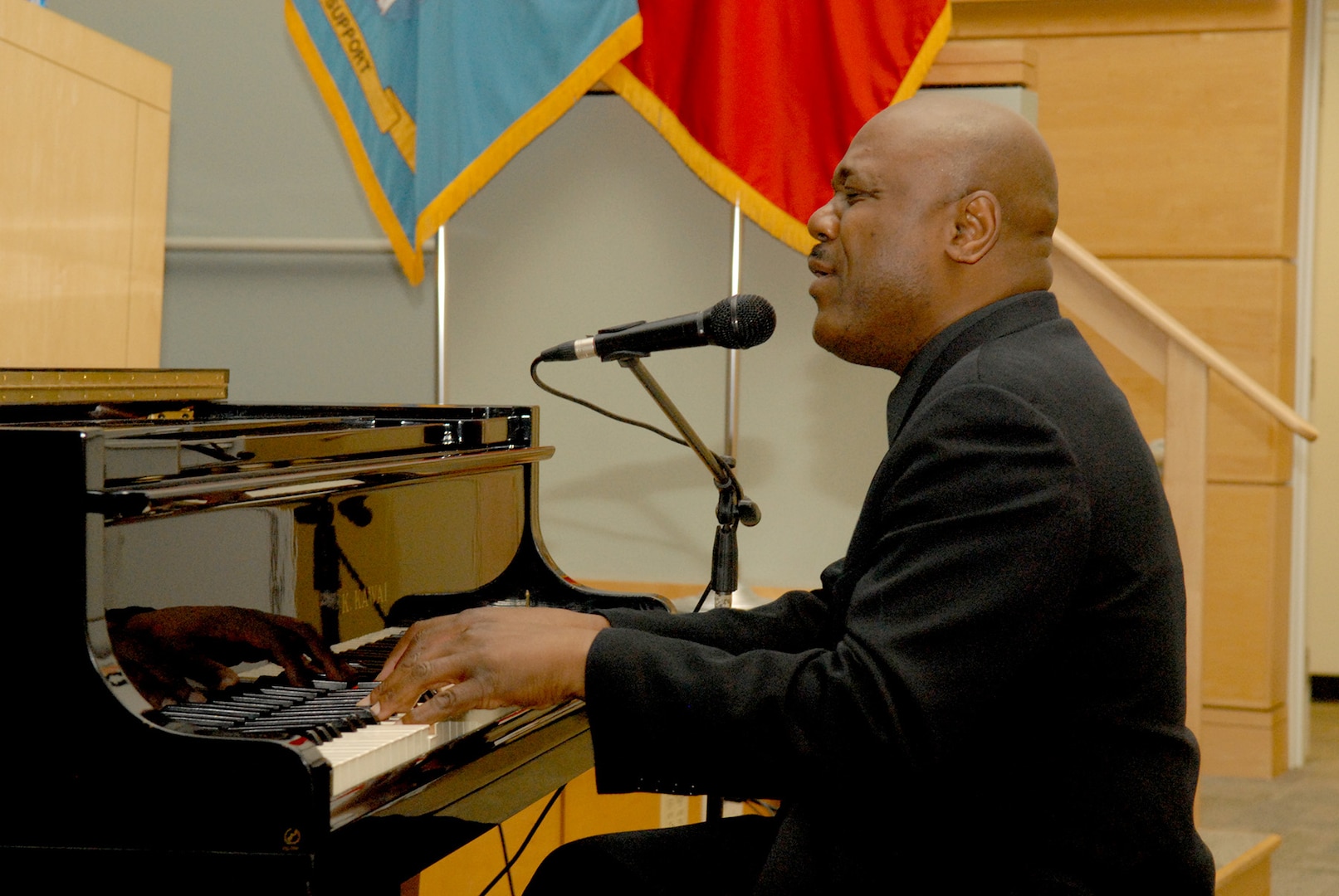 Joe Patterson, producer and president of Key Arts Productions, plays the piano as part of a performance by The Three Soulful Tenors during an African-American History Month observance Feb. 14 at NSA Philadelphia.