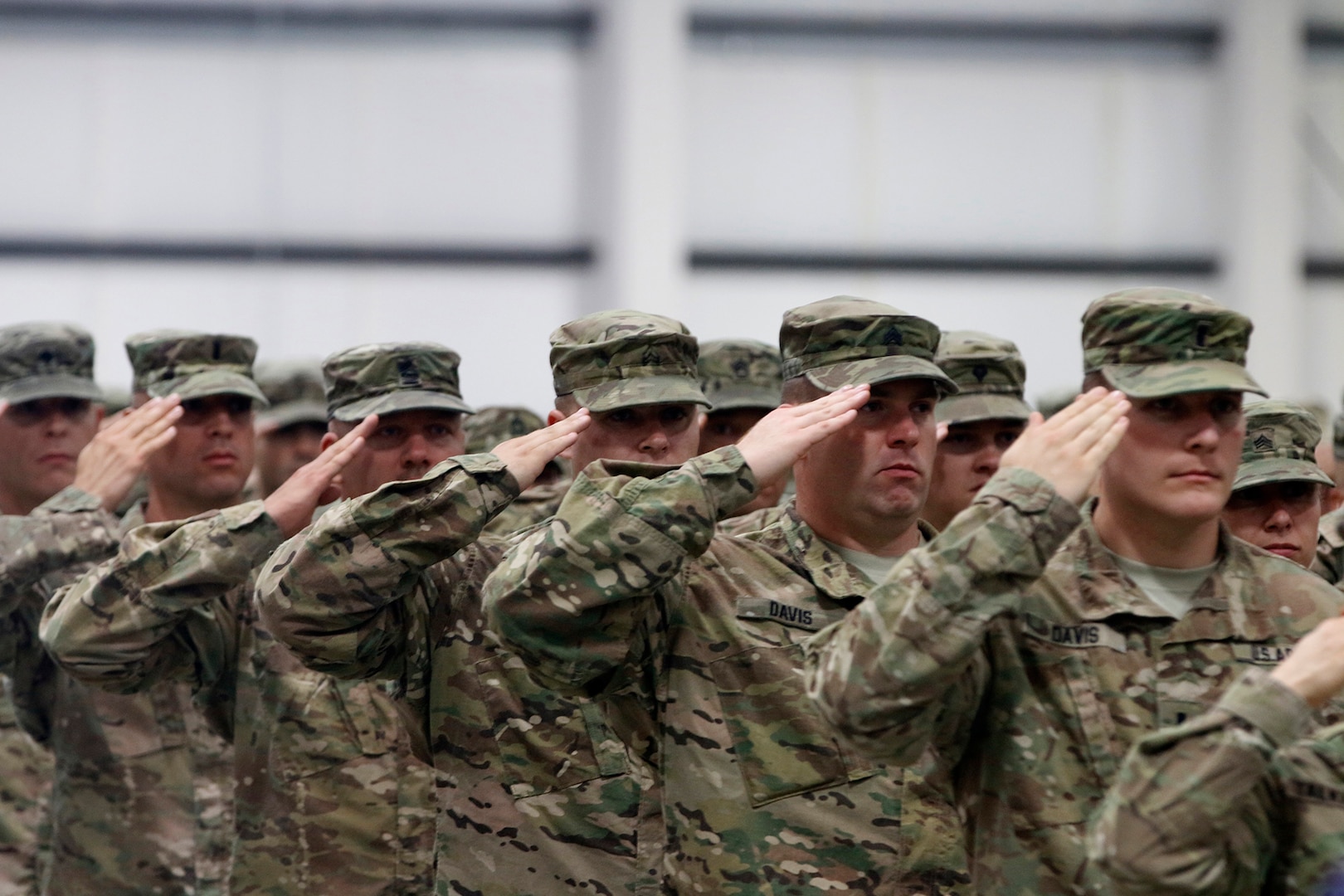 Soldiers from 2nd Battalion, 162nd Infantry Regiment, Oregon Army National Guard, render a salute during the National Anthem at  their demobilization ceremony in Albany, Oregon, June 13. The 2-162nd Infantry Battalion spent approximately 10-months in Kabul, Afghanistan, performing various security duties and training Afghan National Police forces. 