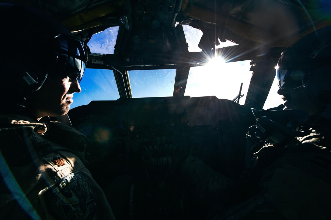 Air Force Maj. Ben, left, and Capt. Justin fly a B-52 Stratofortress aircraft in support of Operation Inherent Resolve, Feb. 13, 2017. Ben and Justin are pilots assigned to the 96th Expeditionary Bomber Squadron. Air Force photo by Senior Airman Jordan Castelan 
