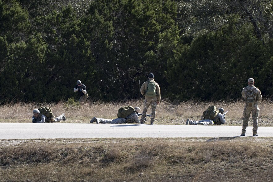 Air Liaison Officer Aptitude Assessment cadre observe while Air Force Academy cadets conduct small unit tactics during an Air Liaison Officer Aptitude Assessment, Feb. 15, 2017, at Camp Bullis, Texas. The cadets were ambushed by cadre firing blanks multiple times during the land navigation portion of their assessment. (U.S. Air Force photo by Airman 1st Class Daniel Snider)
