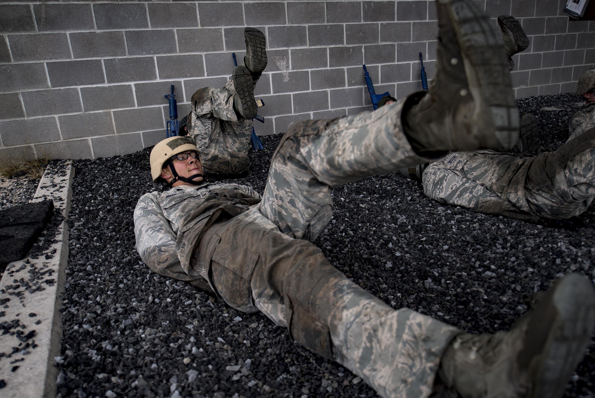 Air Force Academy Cadet Jones conducts flutter kicks during an Air Liaison Officer Aptitude Assessment, Feb. 14, 2017, at Camp Bullis, Texas. The cadets were divided into two groups for the tasked obstacle portion of the assessment, leaving the other group time to work out. (U.S. Air Force photo by Airman 1st Class Daniel Snider)