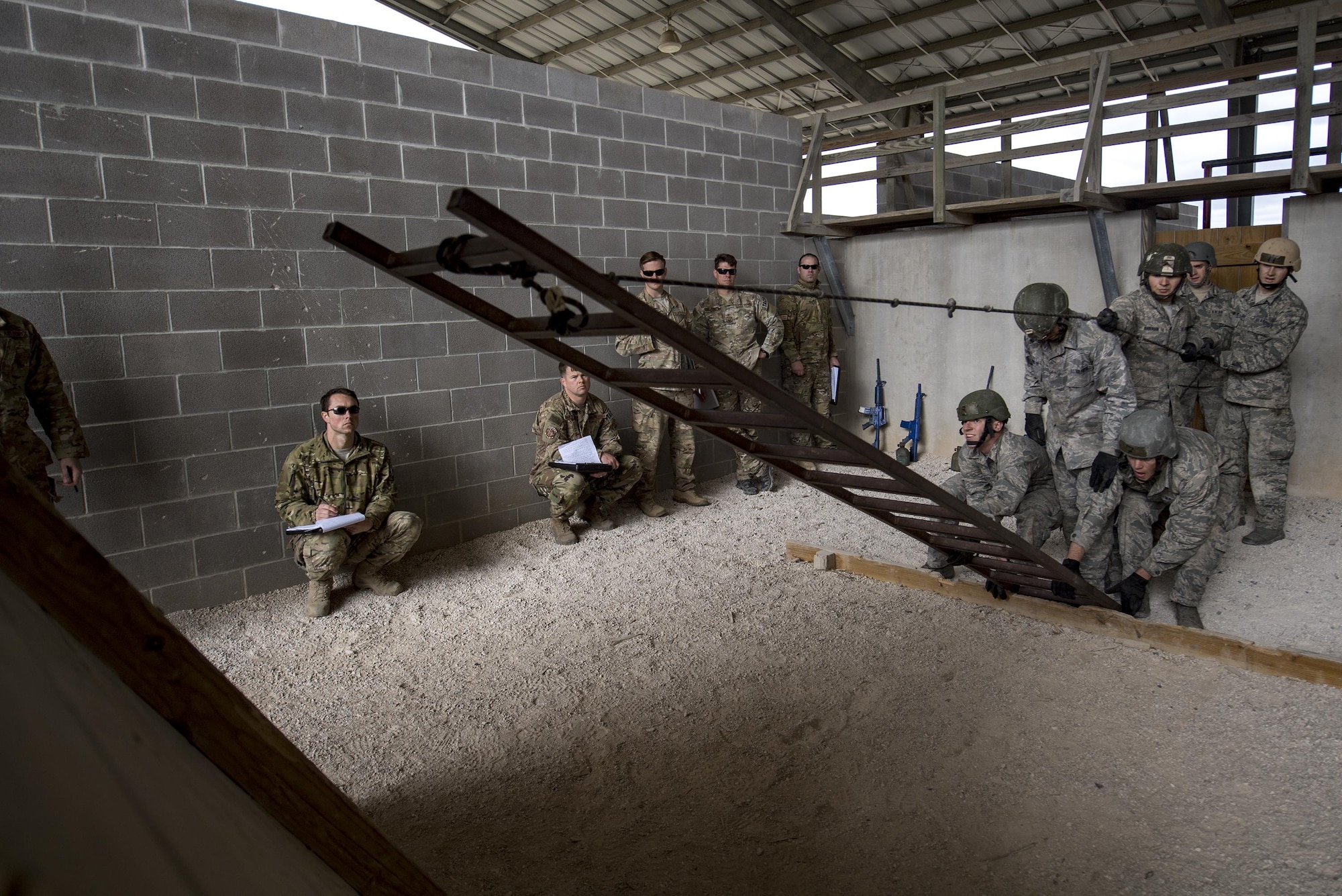 Air Force Academy Cadets work to complete a tasked obstacle during an Air Liaison Officer Aptitude Assessment, Feb. 14, 2017, at Camp Bullis, Texas. The cadets were forced to use critical thinking skills to complete tasked obstacles as a team. (U.S. Air Force photo by Airman 1st Class Daniel Snider)