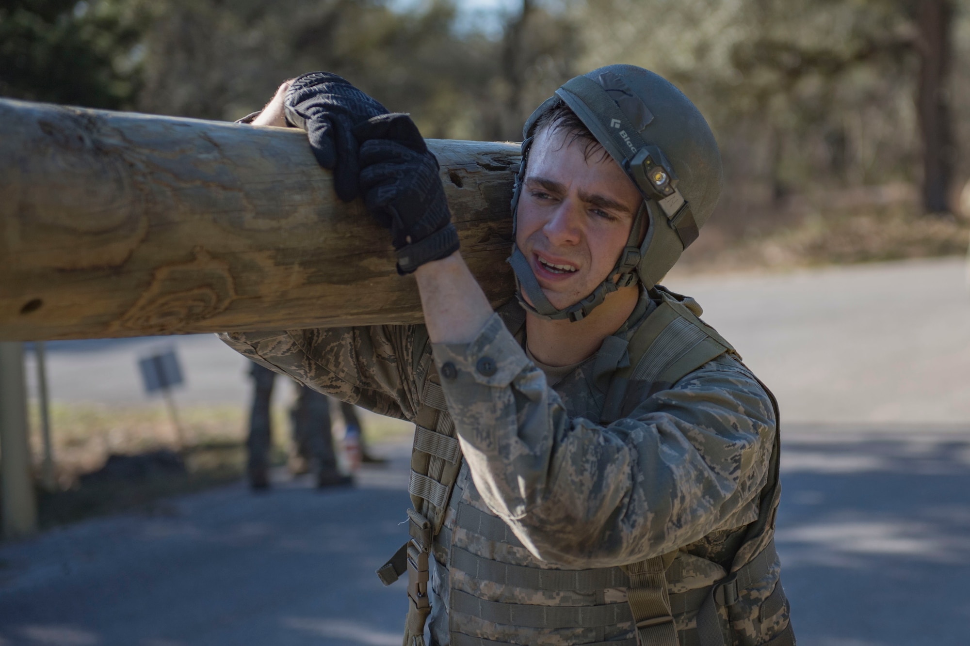Air Force Academy Cadet Ervin carries a log over his shoulder during a medical evacuation march at an Air Liaison Officer Aptitude assessment, Feb. 16, 2016, at Camp Bullis, Tx. The week-long assessment allows current ALOs and enlisted cadre to decide if the cadets are worthy of progressing to the Tactical Air Control Party schoolhouse. (U.S. Air Force photo by Airman 1st Class Daniel Snider)