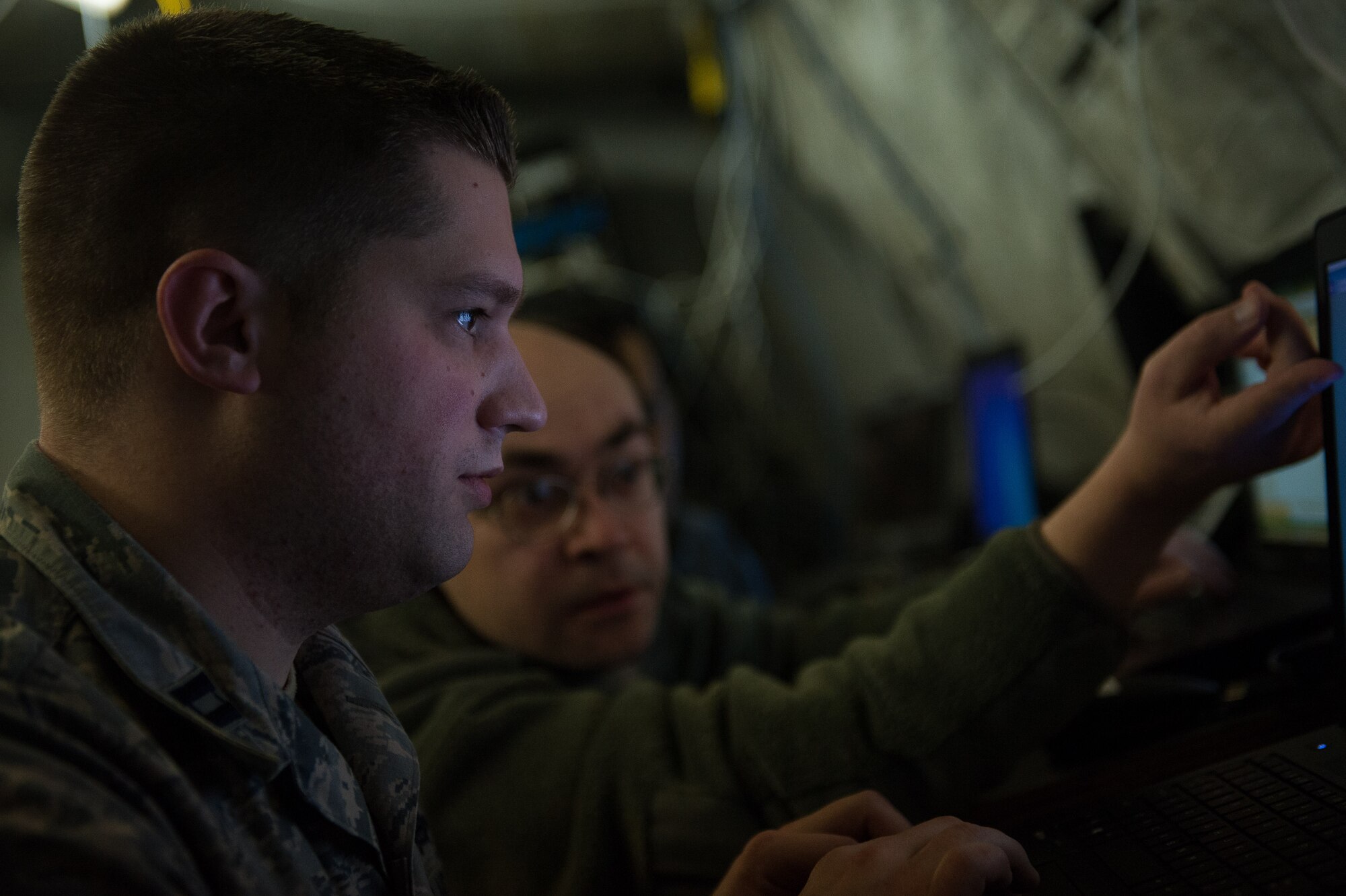 Capt. Andrew Marlow, 1st Combat Communications Squadron flight commander, maintains network infrastructure during a training exercise on Ramstein Air Base, Germany, Feb. 16, 2017. The unit manages tactical communications and navigation equipment that provides essential continuity between deployed units and their home bases. (U.S. Air Force photo by Senior Airman Lane T. Plummer) 