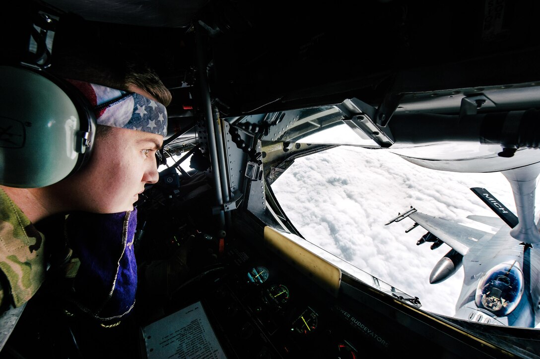 Air Force Senior Airman Stetson refuels an Air Force F-16 Fighting Falcon from a KC-135 Stratotanker supporting Operation Inherent Resolve, Feb. 15, 2017. Stetson is a boom operator assigned to the 340th Expeditionary Air Refueling Squadron. Air Force photo by Senior Airman Jordan Castelan  