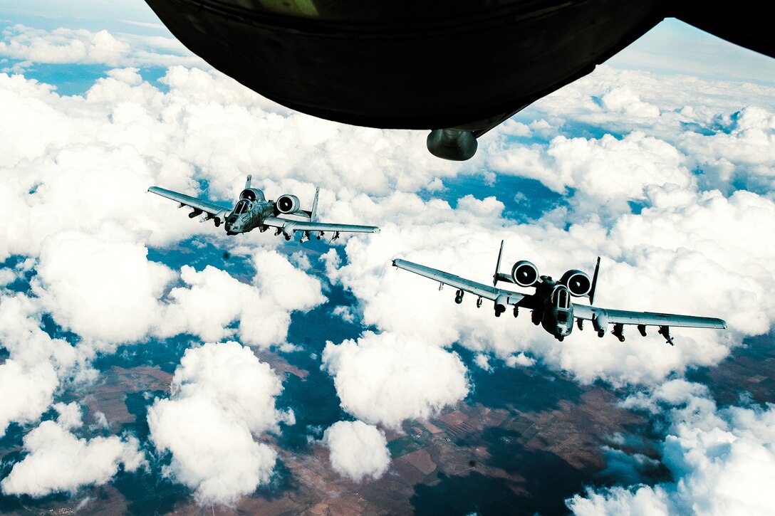 Two Air Force A-10 Thunderbolt IIs fly in a wingtip formation after refueling from a KC-135 Stratotanker in support of Operation Inherent Resolve, Feb. 15, 2017. Air Force photo by Senior Airman Jordan Castelan