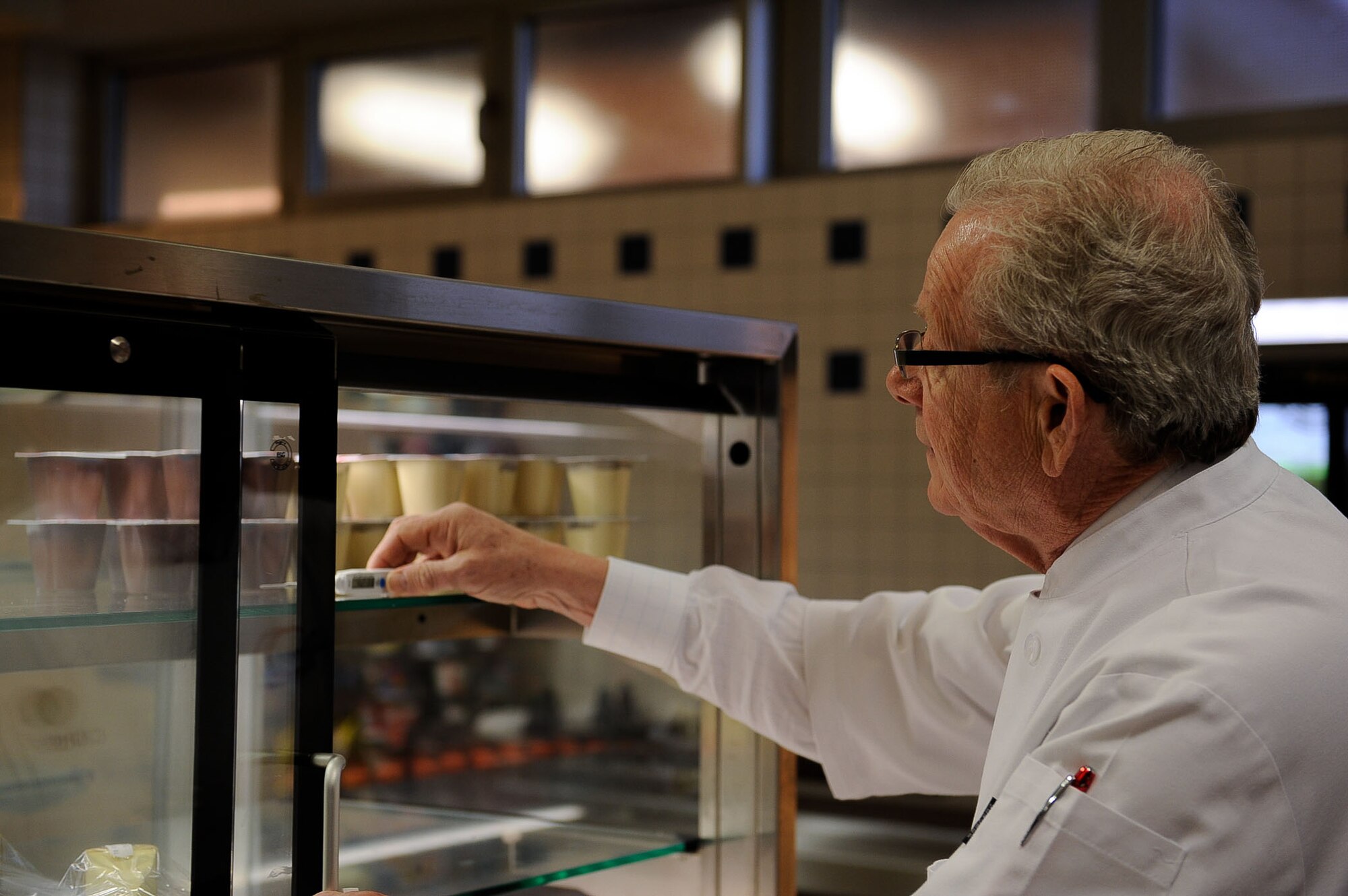 Peter Christie, Restaurant and Not-For-Profit Industries contactor, records the temperature of a refrigeration unit during an inspection for the 61st Annual Hennessy Trophy Awards Program at Lindberghof Dining Facility on Kapaun Air Station, Germany, Feb. 21, 2017. The nomination, in recognition of the outstanding work done at the 786th Force Support Squadron’s food service operations, is part of a program that promotes excellence in customer service and meal quality, inspires morale, and improves management concepts and practices. (U.S. Air Force photo by Airman 1st Class Savannah L. Waters)