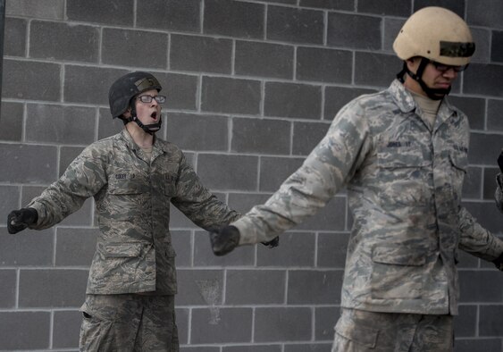 U.S. Air Force Academy Cadet Matthew Coley leads an exercise during the Air Liaison Officer Aptitude Assessment, Feb. 14, at Camp Bullis, Texas. The cadets were divided into two groups for the tasked obstacle portion of the assessment, leaving the other group time to workout. (U.S. Air Force photo by Tech. Sgt. Zachary Wolf)